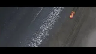 aerial view of beach with tire tracks — Cars 3