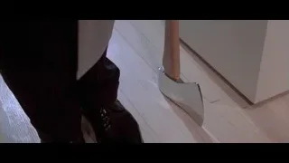 axe near person's foot on wooden floor — American Psycho