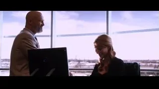 bald man and woman with city view — Iron Man
