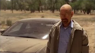Bald man in front of car in desert — Breaking Bad