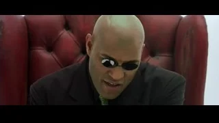bald man in suit and sunglasses in armchair — The Matrix