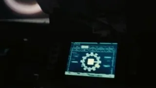 Black object with orange glow in dark room — Interstellar
