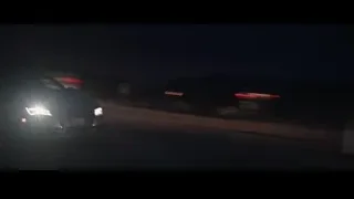 car driving on wet highway at night — Iron Man 3