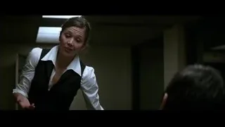 distressed woman with man in dark room — Batman: The Dark Knight