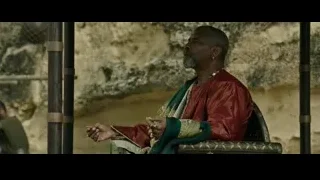 elderly man in red robe on throne — Gladiator 2