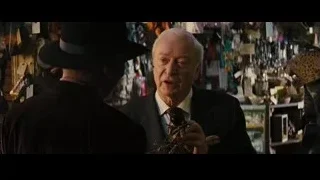 elderly man in suit examining insect in store — Now You See Me