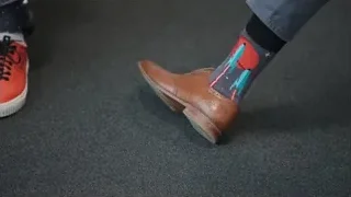 feet in colorful socks and brown shoes — Elon Musk: Return to Space