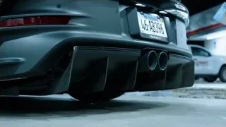grey sports car parked in garage — Sports Cars