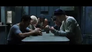 group of people at table in dim metal room — The Matrix