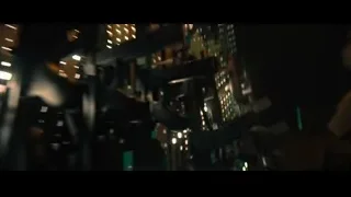 hand reaching towards cityscape at night — John Wick: Chapter 4