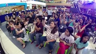 large crowd holding phones in shopping mall — Screened Out