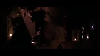 Large explosion in dark industrial room — Batman: The Dark Knight