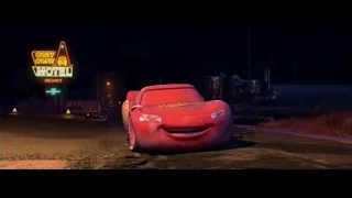 Lightning McQueen driving past Cozy Gone Motel sign — Cars
