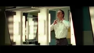 Man adjusting tie in front of mirror — Steve Jobs