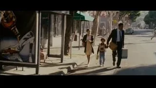 man and boy walking on busy street — The Persuit of Happyness