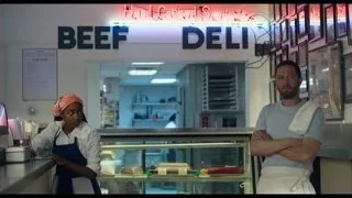 Man and woman at deli counter — The Bear