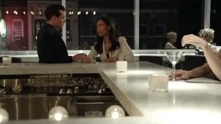 man and woman conversing at bar counter — Suits