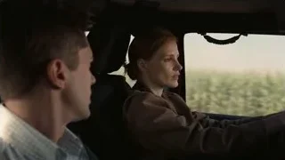 man and woman in car looking out window — Interstellar