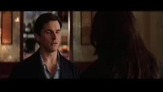 Man and woman in dimly lit bar — Batman