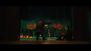 Man and woman in dimly lit temple — John Wick: Chapter 4