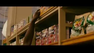 man and woman in grocery store — The Dictator