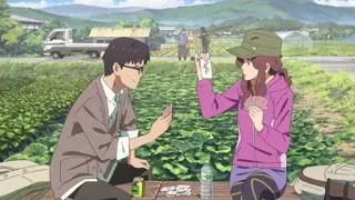 man and woman playing cards at picnic table — Your Name