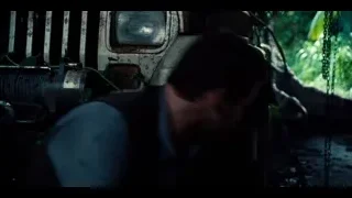 man and woman with large dinosaur head — Jurassic World