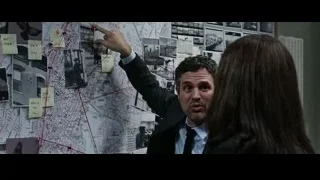 man and woman with wall map and photographs — Now You See Me 2