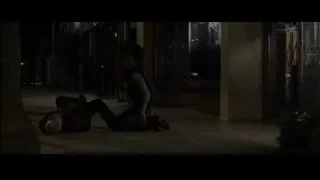 man crouching over unconscious person in alley — The Amazing Spider Man