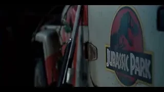 man holding gun in garage with truck — Jurassic World