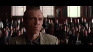 man in beige blazer in front of crowd — Batman