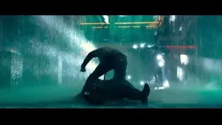 man in black suit in city at night — John Wick: Chapter 4