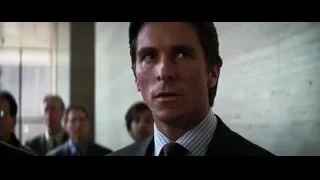 Man in dark suit looking serious — Batman: The Dark Knight