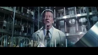 man in futuristic suit speaking to crowd — The Amazing Spider Man 2