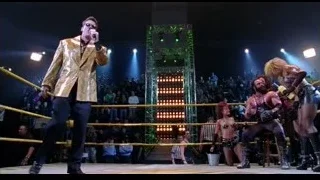 man in gold suit speaking in wrestling ring — Spider Man