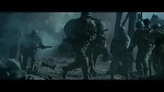 man in military uniform carrying child — Hacksaw Ridge