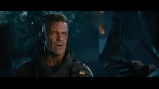 man in red and black suit with hood — Deadpool 2