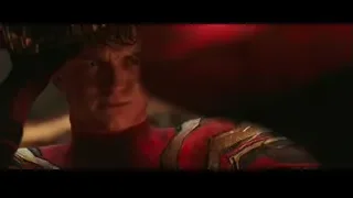 Man in red and gold suit holding gun — Spiderman: No Way Home