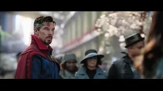 man in red cape on city street — Doctor Strange 2