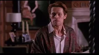 man in red jacket sitting by fireplace — Spider Man