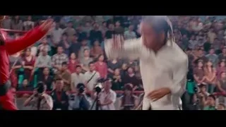 man in red shirt with serious expression — The Karate Kid