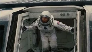 man in space suit entering spacecraft — Interstellar