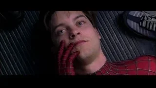 Man in Spiderman suit resting on black surface — Spider Man 2
