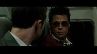 man in suit and sunglasses in airplane — Fight Club