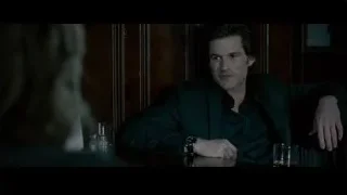 man in suit at table with whiskey — Limitless