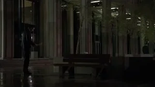 Man in suit by building on wet night — Suits