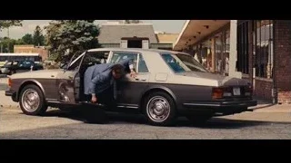man in suit getting out of car — The Wolf Of Wall Street