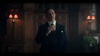 man in suit in dimly lit wooden room — Peaky Blinders