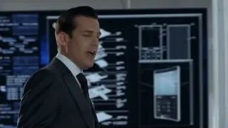 man in suit in front of screen — Suits