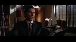 man in suit in office with sailboat — Batman